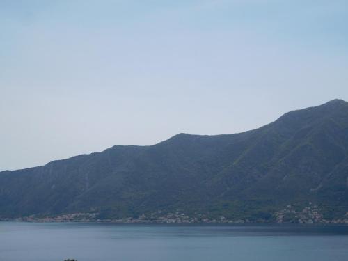 a large body of water with mountains in the background at Villa Aronija in Kotor