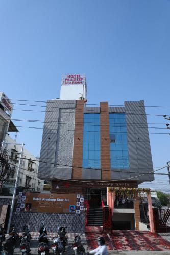 a building with motorcycles parked in front of it at Hotel Pradeep Star Inn in Gorakhpur