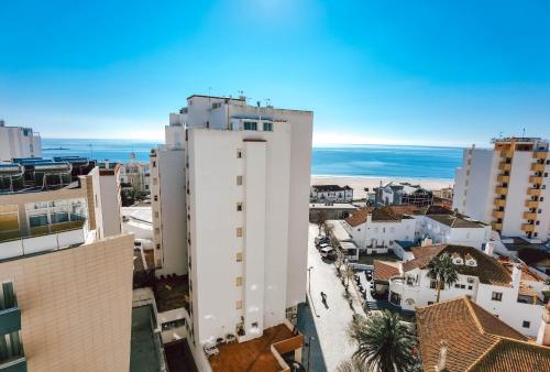 an aerial view of a city with buildings at Apartment Rocha Vista Mar Dubai in Portimão