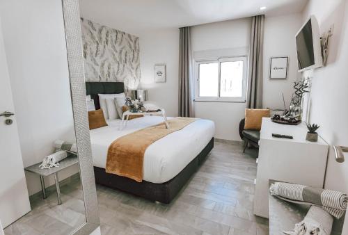 Postel nebo postele na pokoji v ubytování Apartment Rocha Vista Mar Dubai