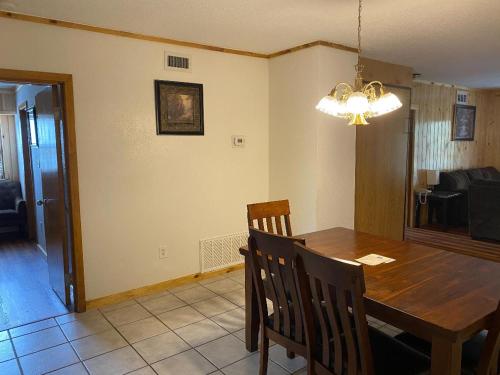 a dining room with a wooden table and chairs at Zoders Inn and Suites in Gatlinburg