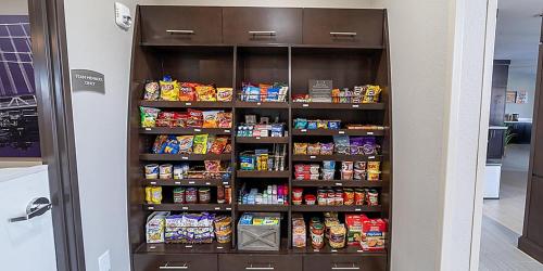 a pantry filled with lots of food and drinks at Staybridge Suites - Houston NW Cypress Crossings by IHG in Houston