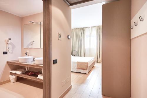 Postel nebo postele na pokoji v ubytování Ferretti MajesticHouse
