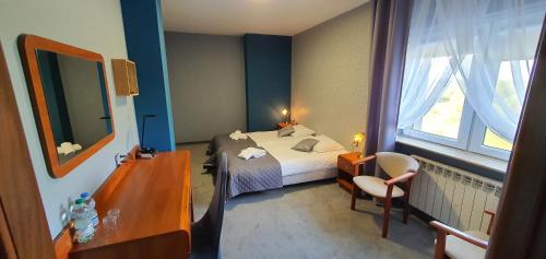 Katil atau katil-katil dalam bilik di Hotel Bursztynowy