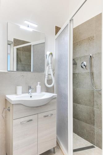 a bathroom with a sink and a shower at Casemurate di Ravenna in Casemurate
