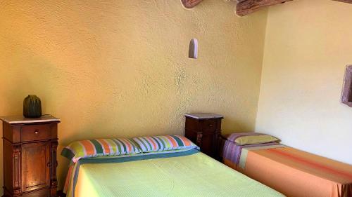 Albergo diffuso Ecobelmonteにあるベッド
