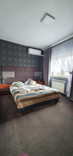 Katil atau katil-katil dalam bilik di Hotel Bursztynowy