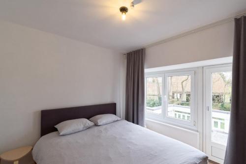 Una cama o camas en una habitación de Dima Gbeniet