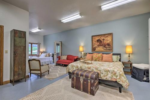 a bedroom with a bed and a living room at Peaceful Fayetteville Getaway - Pets Welcome! in Fayetteville