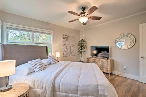 a bedroom with a bed and a ceiling fan at Updated Fayetteville Home Less Than 2 Miles to UArk! in Fayetteville