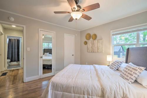 a bedroom with a bed and a ceiling fan at Updated Fayetteville Home Less Than 2 Miles to UArk! in Fayetteville