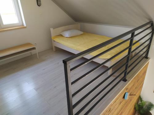A bunk bed or bunk beds in a room at SOWI KĄT domki i apartamenty