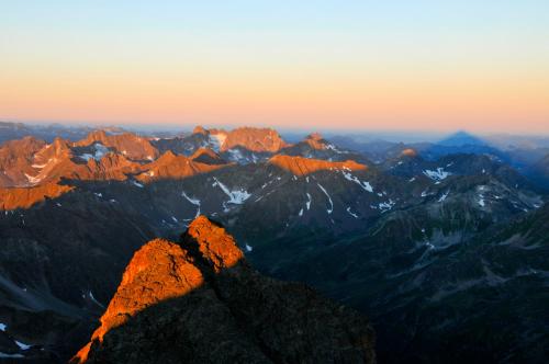 a view from the top of a mountain at sunset at Haus Fischer in Pettneu am Arlberg