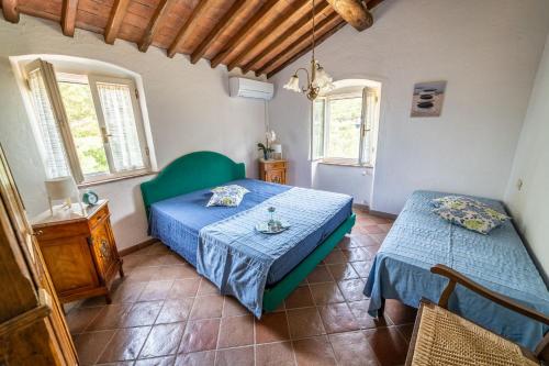 Postel nebo postele na pokoji v ubytování Casa Rossa Lacona