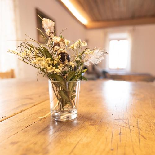 a vase filled with flowers sitting on a table at Josefshof in Kühnring