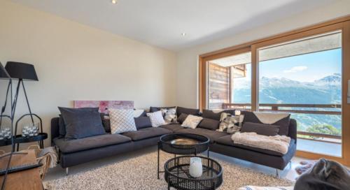 Zona de estar de Magnifique appartement dans Résidence de Luxe - Dixence Resort Complexe SPA