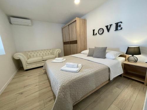 Ένα ή περισσότερα κρεβάτια σε δωμάτιο στο Apartments Nona