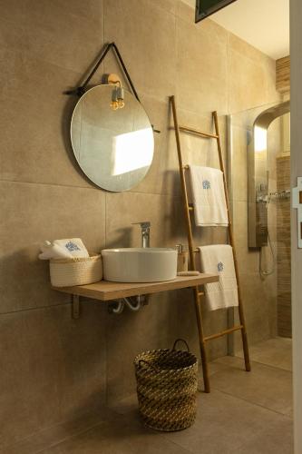 a bathroom with a sink and a mirror at Behappy Lodge & Rooftop in Esmoriz