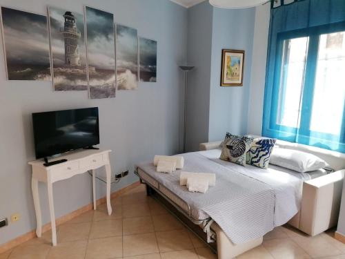 Postel nebo postele na pokoji v ubytování Casa Il Faro