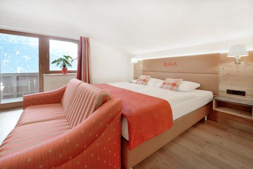 Postel nebo postele na pokoji v ubytování Hotel Alpina Superior