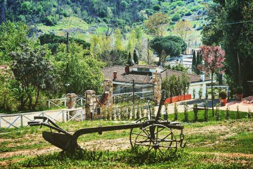 a statue in the grass in front of a house at La valle B&B in Cavriglia
