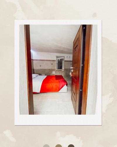a small room with a bed and a mirror at La Torretta in Santeramo in Colle