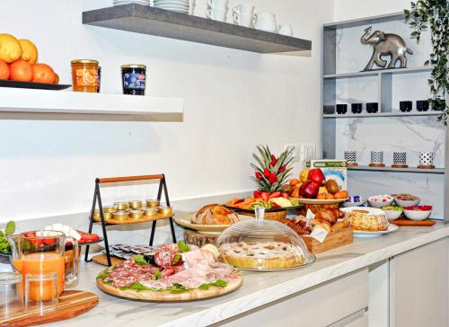 a buffet with many different types of food on a counter at Vele d'Otranto B&B in Otranto