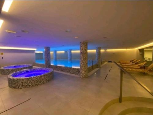 a large building with a pool in the middle at NOVAK apartman in Vrnjačka Banja