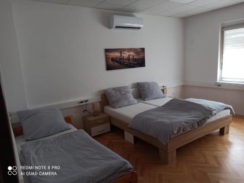 Postelja oz. postelje v sobi nastanitve Apartmanový dom Stummerova