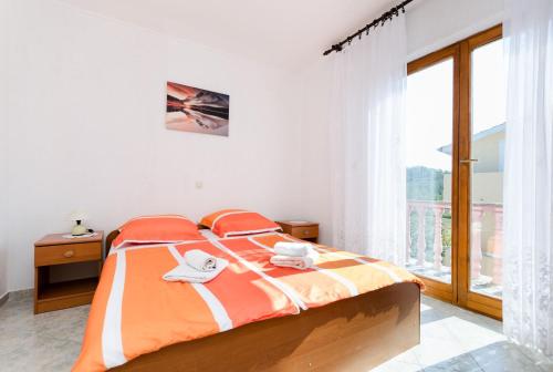Postel nebo postele na pokoji v ubytování Apartments Danica