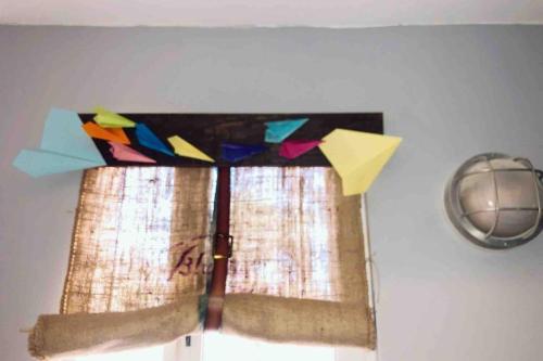 a window in a room with a curtain with at Sol-O-Cien Estrella No Check Out Chores in Rosarito