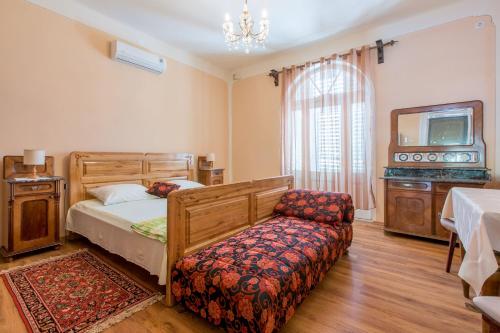 Postel nebo postele na pokoji v ubytování Villa Drago
