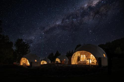 a group of domes at night under a starry sky at Cross Hill Glamping in Lake Hāwea