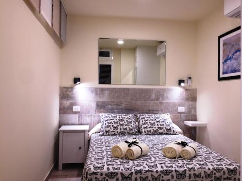 a bedroom with a bed with two pillows on it at Atlantic Coast Apartment - Playa Del Inglés in Playa del Ingles