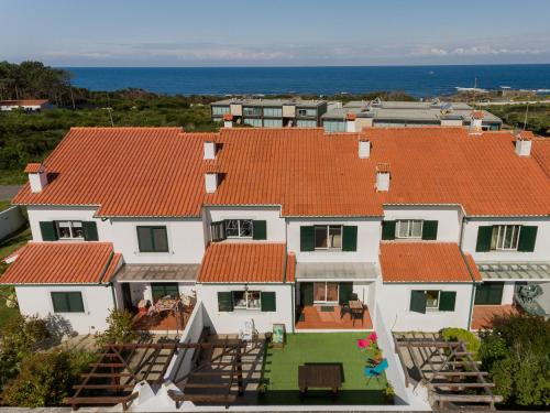 an aerial view of a house with orange roofs at Gelfa Beach House in Viana do Castelo