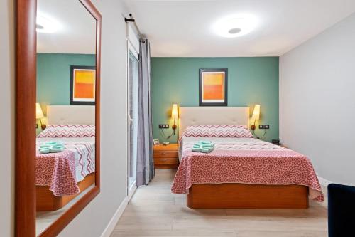 Posteľ alebo postele v izbe v ubytovaní Burriana Centro