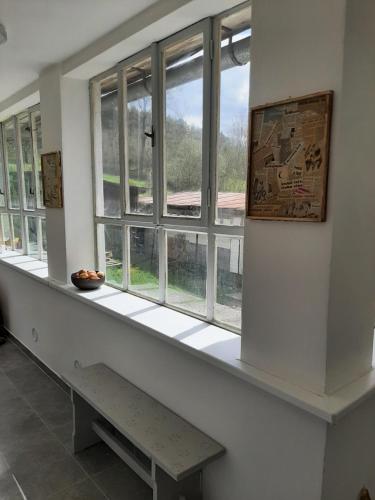 a window in a room with a bench in front of it at Babičkin Dom in Medzilaborce