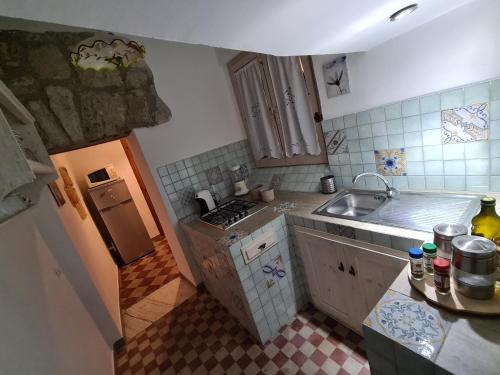 Kuchyň nebo kuchyňský kout v ubytování Agorà Sant’anna Apartment