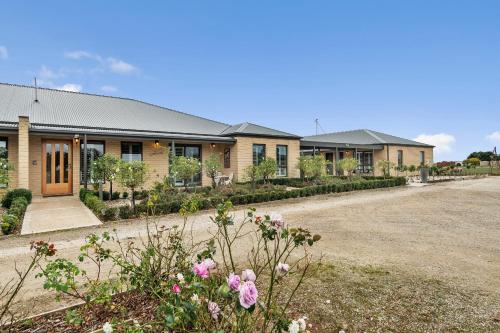 a row of houses with flowers in front of them at The Oxley Estate in Portarlington