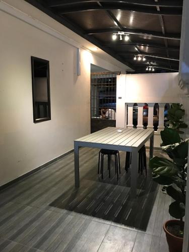 a table in the middle of a room at Homestay Muar in Muar