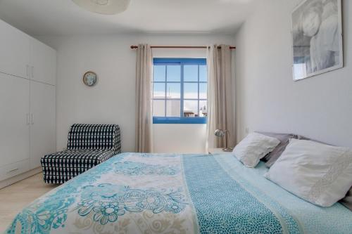Ένα ή περισσότερα κρεβάτια σε δωμάτιο στο Casa Rosa