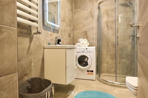 Et badeværelse på MoonStar Apartment - Spa n Pools beach Resort