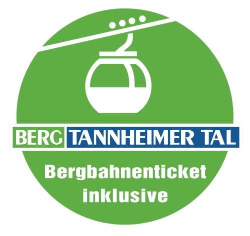 a green sign with a teapot and the words ber ber exterminator lab at Alpenappartement Kleiner in Tannheim