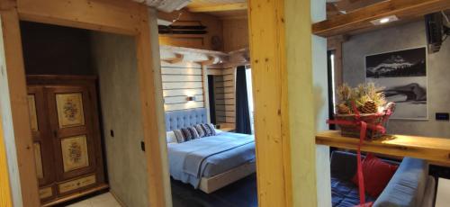 a bedroom with a bed in a small room at Albergo Chalet Lago Antorno in Misurina