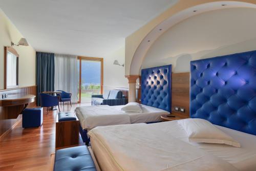Posteľ alebo postele v izbe v ubytovaní Hotel Alexander