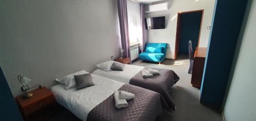 Katil atau katil-katil dalam bilik di Hotel Bursztynowy