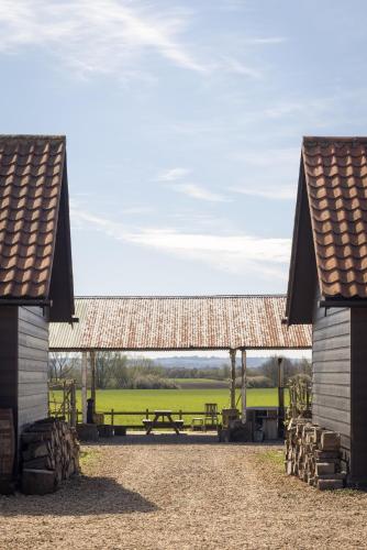 a picnic shelter with a picnic table in a field at Clopton Courtyard Cambridge in Cambridge