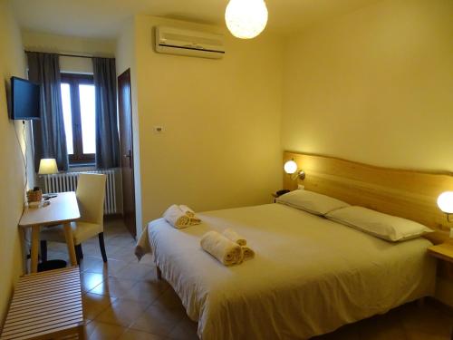 Llit o llits en una habitació de Trattoria della Posta