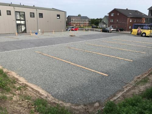 an empty parking lot with yellow lines on it at WoMo-Stellplatz Schäfer in Sankt Peter-Ording