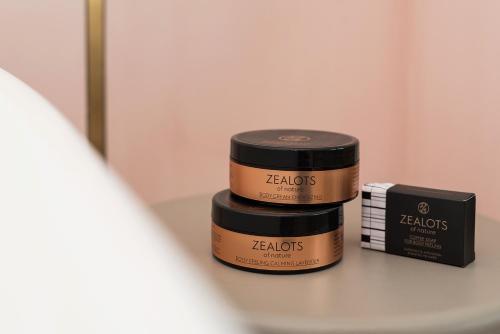 two jars of hair products sitting on a table at Coco-mat Athens BC in Athens
